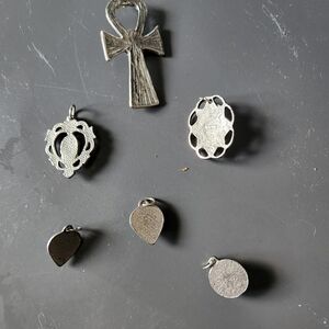 6 silver pendants with turquoise colored stones